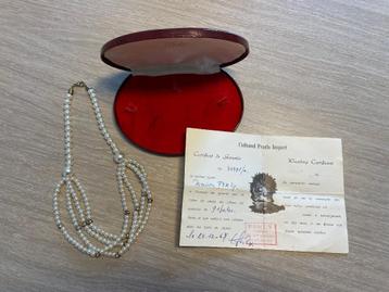 Parelsnoer + certificaat (1967) beschikbaar voor biedingen