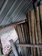 Houten palen verschillende lengtes, Ophalen