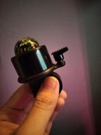 Fietsbel met kompas, Ophalen