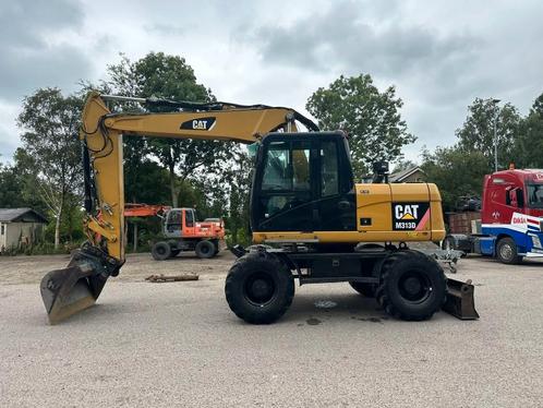 Cat M 313 D (bj 2010), Zakelijke goederen, Machines en Bouw | Kranen en Graafmachines, Graafmachine