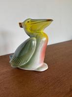 Mooie iriserende pelikaan, Ophalen