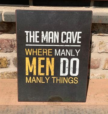 Zwart metalen uithangbord “the man cave” beschikbaar voor biedingen