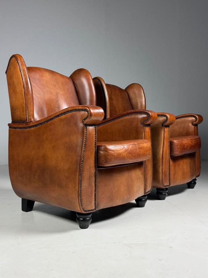 Set van 2 schapenleren clubfauteuils, Huis en Inrichting, Fauteuils, Zo goed als nieuw, Ophalen