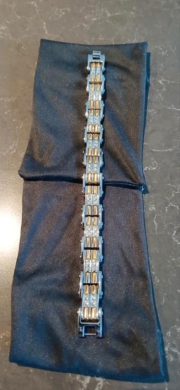 Prachtig tweekleurige herenarmband.  beschikbaar voor biedingen
