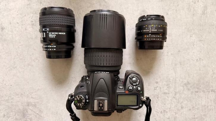 📸 Nikon D7000 + 3 lenzen + toebehoren – ideale startersset!, Audio, Tv en Foto, Fotocamera's Digitaal, Gebruikt, Spiegelreflex