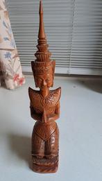 Houten Thais beeldje, Ophalen