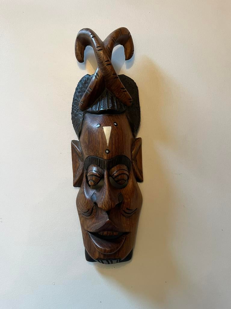 Afrikaans houten beeldje, Ophalen