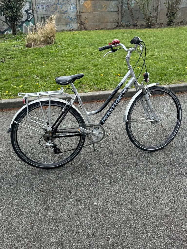 Vélo PRESTIGE 28 pouces 8V en aluminium inoxydable., Vélos & Vélomoteurs, Vélos | Femmes | Vélos de sport & de randonnée, Comme neuf