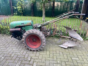Holder E12 met ploeg en frees beschikbaar voor biedingen