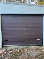 Elektrische garagepoort met afstandsbediening, Ophalen