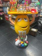 Grand figurine m&m, Ophalen