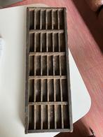 Houten drukletter doos, Ophalen