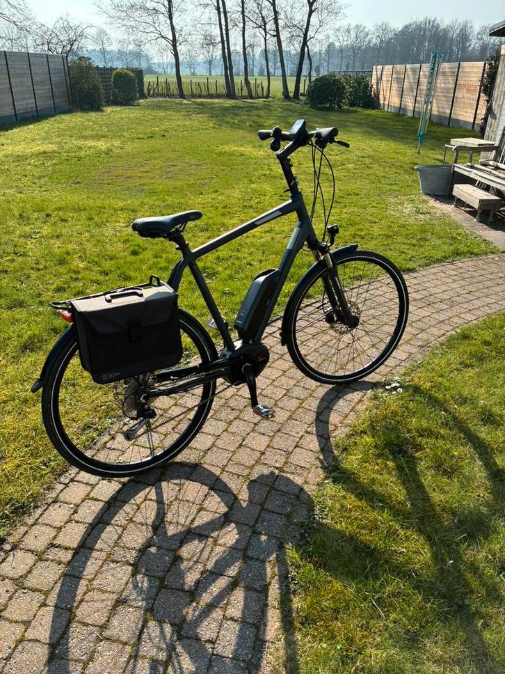 Raleigh elektrische herenfiets, Fietsen en Brommers, Elektrische fietsen, Zo goed als nieuw, 59 cm of meer, Ophalen