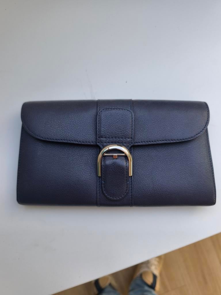 Delvaux portemonnee, Enlèvement