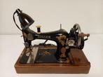 antieke singer naaimachine, Ophalen