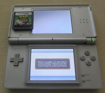Nintendo DS Lite + 1 spelletje - Zilver - zie beschrijving  beschikbaar voor biedingen