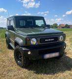 Suzuki Jimny 1.5i - 2000km, Auto's, Stof, USB, Handgeschakeld, Vierwielaandrijving