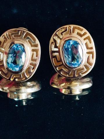 Gouden oorbellen met blauwe topaas  beschikbaar voor biedingen