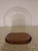 Glazen stolp met voet, Ophalen