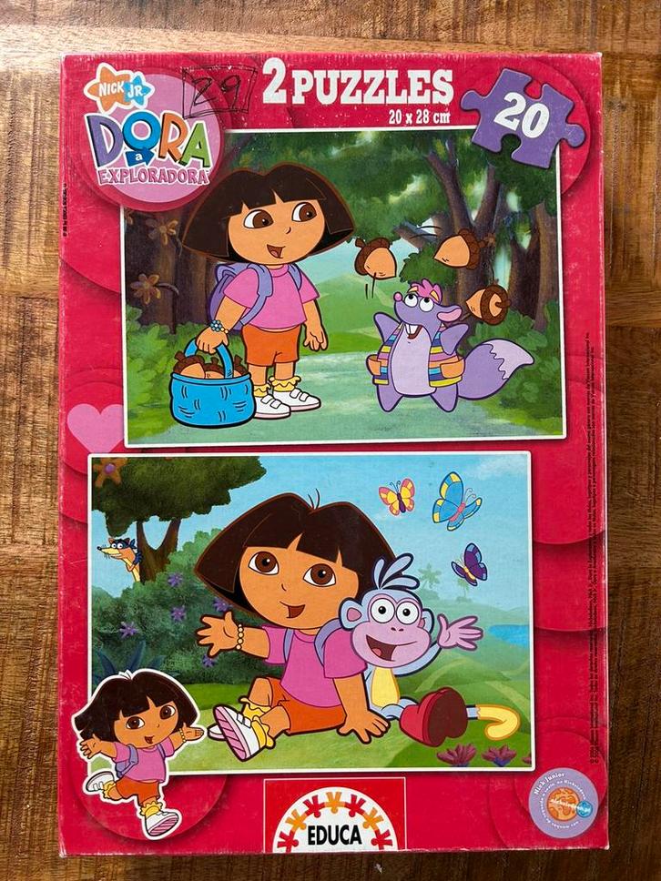 Doos met 2 puzzels van Dora - 2 x 20 stukken, Kinderen en Baby's, Speelgoed | Kinderpuzzels, Gebruikt, 10 tot 50 stukjes, Ophalen of Verzenden