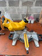 Scie à onglets Dewalt, Ophalen