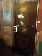 deur in gefumeerd veiligheidsglas dateert uit jaren '70, Enlèvement
