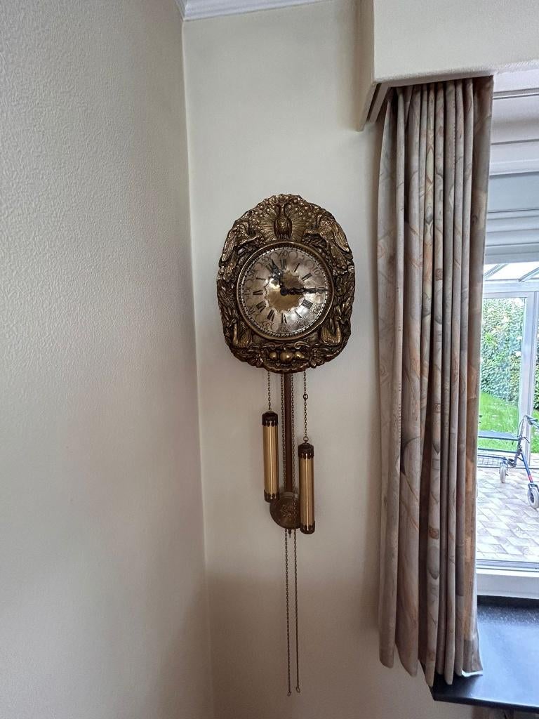 Antieke wandklok, Ophalen