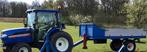 Iseki tractor en aanhangwagen