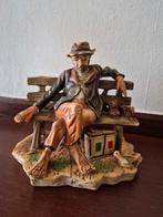 Beeldje zittende man, Ophalen