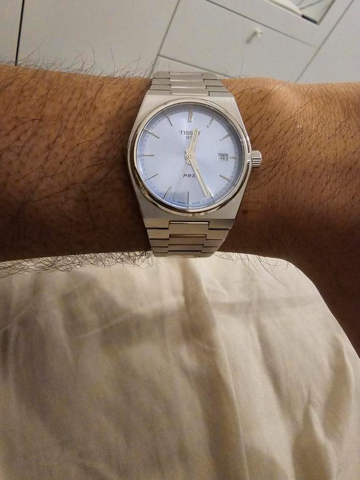 Ruilen Tissot prx 35mm quartz ice blue tegen andere kleur., Handtassen en Accessoires, Horloges | Dames, Zo goed als nieuw, Polshorloge