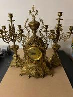 Zwaar koperen klok met 2 kandelaars, Enlèvement