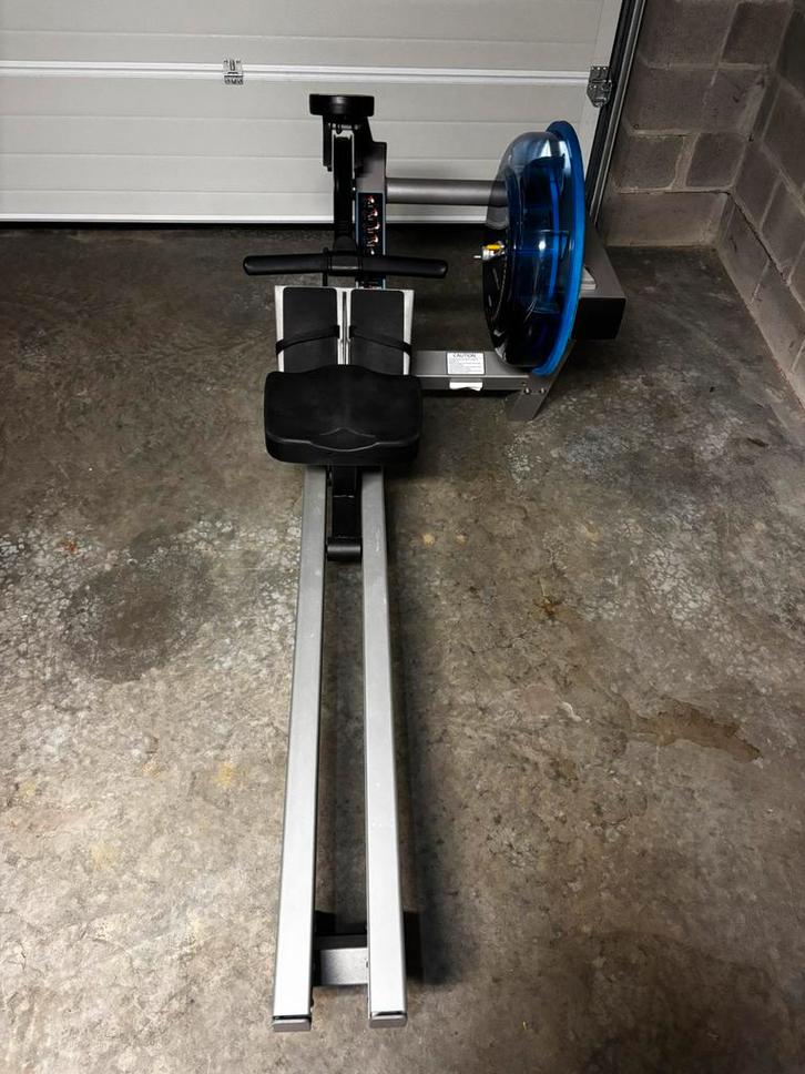 Rameur E-520 Fluid, Sports & Fitness, Appareils de fitness, Comme neuf, Rameur, Métal, Enlèvement