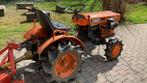 Kubota mini tractor met maaibalk, Ophalen