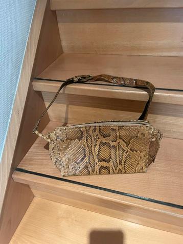 Handtas uit krokodillenleer, Enlèvement, Sac à main