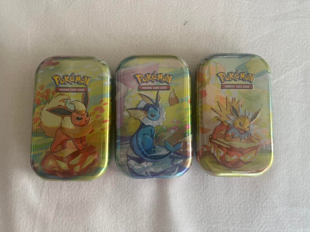 Pokémon Mini Tins – Prismatic Evolutions – Nieuw & Geseald, Ophalen of Verzenden, Zo goed als nieuw, Booster