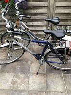 Damesfiets en herenfiets met zakken, Enlèvement