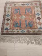 handgeknoopt Kaukasus tapijt, Ophalen