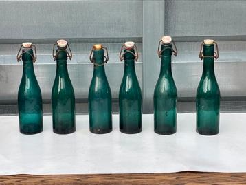 6 oude bierflesjes brouwerij Stella Artois Leuven beschikbaar voor biedingen