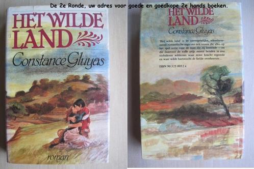 421 - Het wilde land - Constance Gluyas, Boeken, Romans, Zo goed als nieuw, Amerika, Ophalen of Verzenden