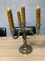 Tinnen kandelaar, Ophalen