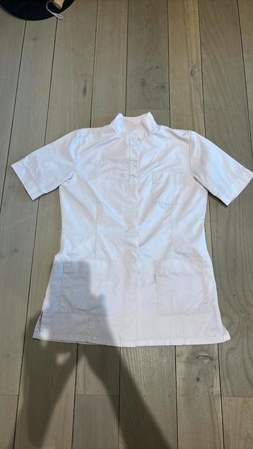 Lichtroze schort beschikbaar voor biedingen