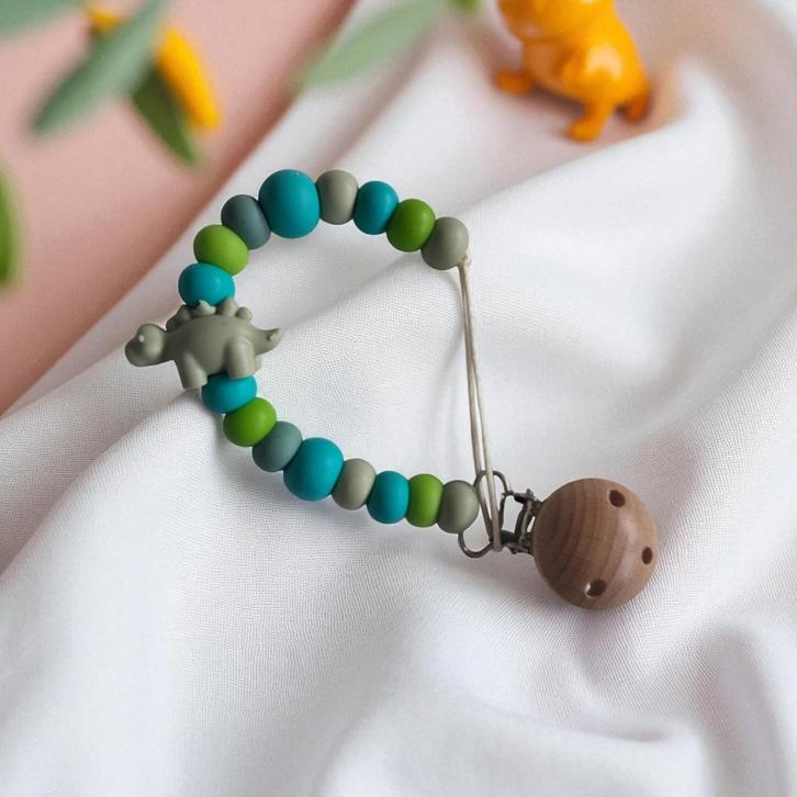 Speenkoord dino turquoise khaki, Kinderen en Baby's, Babymode-accessoires, Nieuw, Verzenden
