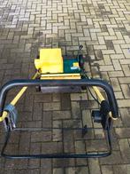 Elektriche verticuteermachine, Enlèvement