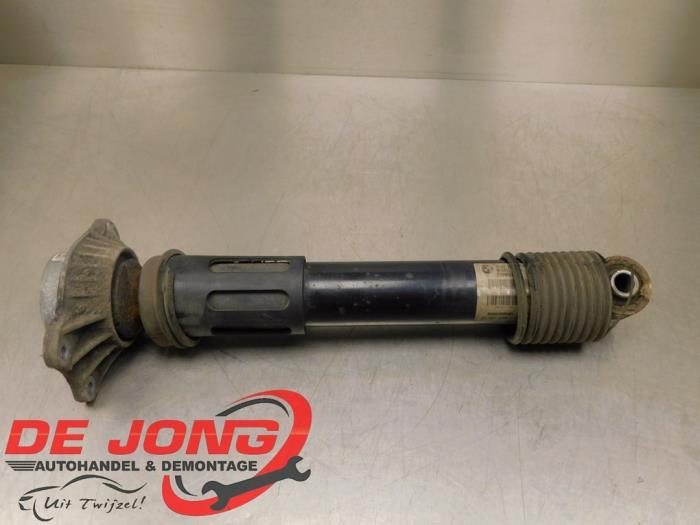 Amortisseur arrière gauche d'un BMW 5-Serie, -, 3 mois de garantie, Utilisé, -