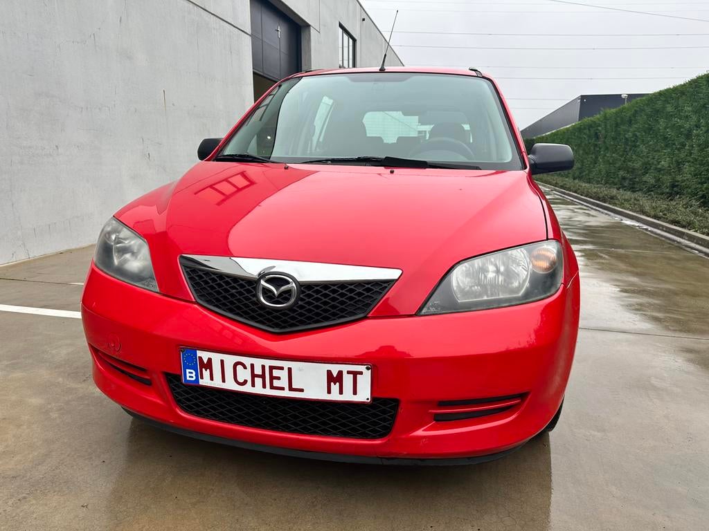 Mazda 2 1.25 Benzine / 1 jaar garantie, Voorwielaandrijving, Stof, 1242 cc, Adaptieve lichten
