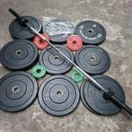 Olympische Bumper Plates Set + Technogym Olympische Barbell, Ophalen, Zo goed als nieuw