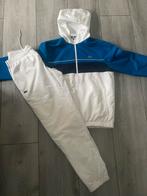 Lacoste trainingspak blauw wit maat S/M, Kleding | Heren, Sportkleding, Lacoste, Ophalen of Verzenden, Zo goed als nieuw, Algemeen