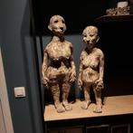 2 beelden in klei, Ophalen