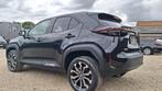 Toyota Yaris Cross 1.5 VVT-ie Hybrid 85kW Dynamic Plus CVT, Auto's, Stof, 750 kg, 116 pk, Bedrijf