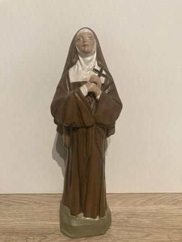 Religieus beeldje van de heilige beschikbaar voor biedingen